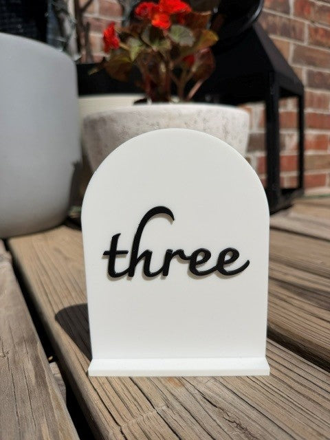 Black arch table number 3 for wedding reception, party, or corporate event decor